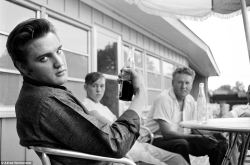 rrrick:   The King: Elvis Presley relaxes with a Pepsi on the porch of his home at 1034 Audobon Drive, Memphis, Tennessee, on July 4, 1956 