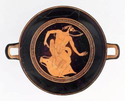 boysnmenart:  Drinking cup (kylix).  Greek, Late  Archaic Period, about 500 B.C. Interior: Within tondo composition  formed by a circular meander pattern, an ithyphallic satyr, with frontal  body and frontal right leg, is seated on an overturned amphora.
