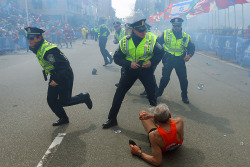 timelightbox:  Photograph by John Tlumacki—The Boston Globe/Getty Images “I was covering the finish line at the ground level at the marathon. Everything was going on as usual. It was jovial — people were happy, clapping — and getting to a point