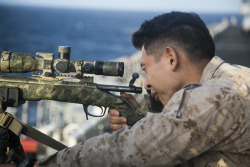 militaryarmament:  U.S. Marines with   scout sniper platoon, Weapons Company, Battalion Landing Team 3rd Battalion, 1st Marine Regiment, 15th Marine Expeditionary Unit, training with sniper rifles aboard the ship USS Essex (LHD 2). INDIAN OCEAN July