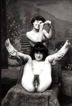 toghh: thosenaughtyvictorians:  Ok not only do we have a potted palm, the striped chaise, paintings of potted palms, and these two lovely ladies, BUT I am pretty sure that the girl in the back is holding a Victorian condom that she’s miming putting