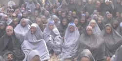 shadowwraiths:  Please take some time away from your regular fandom blogging and reblog this photo of some of the 200  schoolgirls kidnapped by Boko Haram militants in Nigeria. This photo is a still from a video released today by the kidnappers. It is
