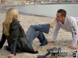 stteevtheslave:  The depths a lowly male will go just to entertain and amuse a member of the superior gender.  lick that sand off her feet!