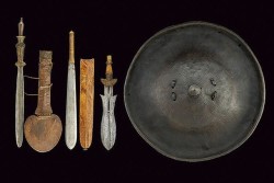 victoriansword:  African Swords and Shield From left to right: Knife/short sword of the Yaka people of Congo  Seme short sword/knife of the Maasai people of Kenya Knife/short sword of the Fang people of Cameroon Rhinoceros hide shield of the Amhara people