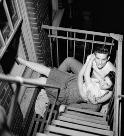 flashofgod:Stanley Kubrick, Couple flirting on a fire escape, 1946.