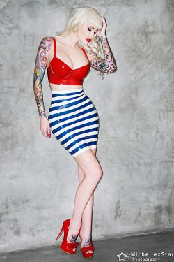 ladylucielatex:Sabina Kelley looking like a super sexy Parisian sailor girl in the LLL breton striped high waisted mini skirt and longline bra. Photo by MichelleX Star photography.