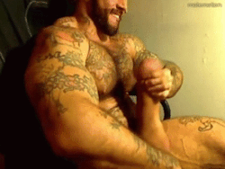 Exceptionally muscled man, awesome tats and a great looking silicone balls and cock - WOOF my kind of man