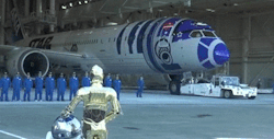 archatlas:  Boeing &amp; ANA unveil R2-D2 Dreamliner Star Wars theme music played and Storm Troopers held guard as the hangar doors began to open. Within moments, a Boeing 787 “Dreamliner” painted with likeness of R2-D2 emerged to a cheering crowd