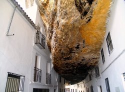 peterfromtexas:The Town that is Literally Living Under a Rock Welcome to the town of Setenil de las Bodegas in Spain, where around 3,000 inhabitants are living quite literally, under a rock. This small white washed town northeast of Cadiz has a unique