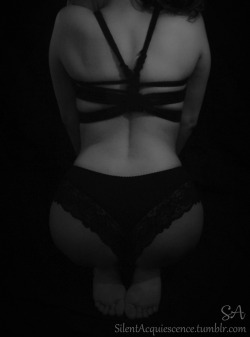 silentacquiescence:  Simple black rope - 1 of 8  Just a black rope chest harness puts L in the right frame of mind. She kneels and waits patiently.  ~J~