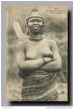   Senegalese woman. Via Delcampe.   