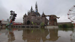 egalitarianqueen:  sixpenceee:  Banky’s Dismaland: Dystopian Theme Park Not Suitable for Children Street artist Banksy opens a theme park like no other. Dismaland features migrant boats, a dead princess and Banksy’s trademark dark humor. Keep reading