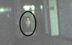 its-spooky-bitch:  slutsbutts:   its-spooky-bitch: This image was taken on the third floor of an abandoned hospital. The figure is supposedly a ghost in a straight jacket, and the floor was where the psychiatric ward of the hospital was.  You know he
