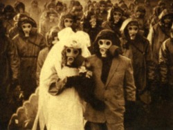 Wedding pic, in Izu Island, the habitants use gas masks because there are high levels of sulfur in the air, due to volcanic activity.