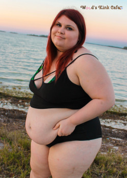 woodsgotweird:  “High by the Beach” photosetWood sensually teases and strips down to her bikini in front of the sunset. Featuring views of her flabby body and tits falling out of her weed-print bikini top. Don’t you want to get high by the beach
