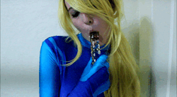 espikvlt:   Bounty Slut   Even bounty hunters get horny, and Samus proves that in this almost nine minute video, where she strips off her zero suit, pulls a dildo out of her holster, simulates a BJ, and masturbates just for you.    The price of this video