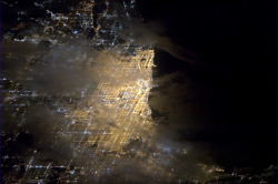 Colchrishadfield:  Chicago, A Bright Spot On The Tip Of Lake Michigan, Glowing Through