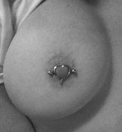 beautiful boob adorned with cute piercing