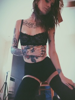 AprilFace shows off her tatts and lace