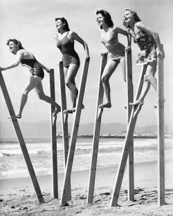hoodoothatvoodoo:  Four young women try their stilt walking skills on the beach in Los Angeles Venice, California. March, 1942. 