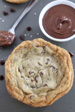 fullcravings:  Giant Nutella Stuffed Chocolate Chip Cookies 