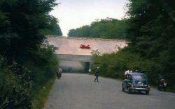 motorsportsarchives:   Just a Scuderia Ferrari 246 whizzing by on the banking.  Monza 1960. 
