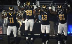 kickoffcoverage:  Rams players enter field with “hands up, don’t shoot” salute to Ferguson Several St. Louis Rams players came out to introductions doing the “hands up, don’t shoot” gesture that people around the country have been doing to