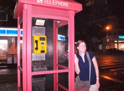 Bethanne in front of an antique phone booth