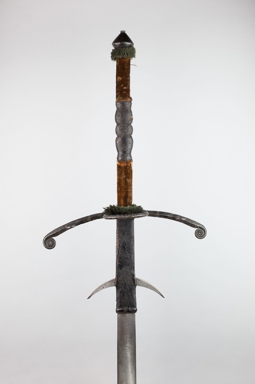 aic-armor:  Two-Handed Sword with Scabbard, 1575, Art Institute of Chicago: Arms, Armor, Medieval, and RenaissanceGeorge F. Harding CollectionSize: Overall L. 169 cm (66 ½ in.) Blade L. (including ricasso): 121.7 cm (47 7/8 in.)Medium: Steel, iron, wood,