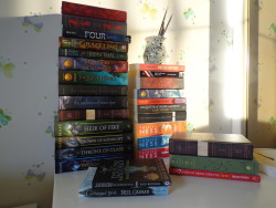 mychemicalbooks:  So I took some pics of my TBR pile today as the sun decided to peak for a while and looked nice on the books. I love all of these so much, they’re gorgeous *-* 