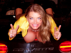Vicky Vette on her Corvette.  Nice air bags!