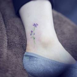 cutelittletattoos:  Watercolor style sweet pea flower tattoo on the ankle. Tattoo artist: Sol Tattoo