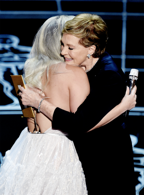 kinginthenorths:Julie Andrews hugs Lady Gaga on stage at the 87th Oscars February 22, 2015 in Hollywood, California