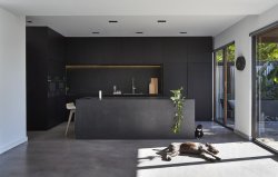 titaniumtopper:  designed-for-life:  M House is a minimalist house located in Melbourne, Australia, designed by DKO. The kitchen space features porcelain ‘Maximum Moon’ throughtout, blacked out custom cabinetry with a black kitchen island that achieves