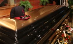 stereoculturesociety:  CultureHISTORY: #MikeBrown Funeral - August 2014  Mike Brown casket w/ St. Louis Cardinals baseball cap Brown’s mother Lesley McSpadden at her son’s service Attendees united in song Funeral attendees Memorial including long