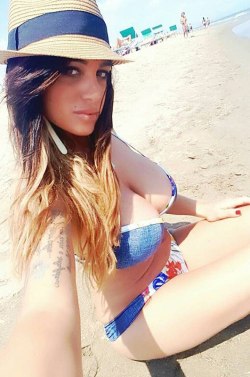 sexciiwomeninlingerieandbikinis:    Marika Fruscio has a nip slip in her bikini as she rolled around in the sand while on the beach in Napoli…