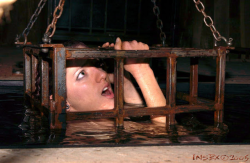 littlejetgirl:  slavefarmer:  Torture and terrorize your slaves in cages  How long can your arms hold you up?  With weights around your ankles pulling you down you can’t rely on floating.  It is hold yourself up or drown.  You have been in this cage