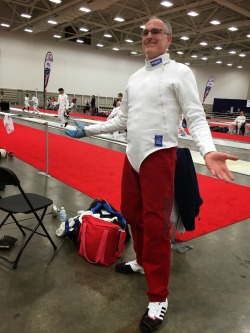 modernfencing:  [ID: an epee fencer posing in a pair of dark red ankle-length knickers.] Joe Deucher, wearing perfectly-legal and amazing knickers! 