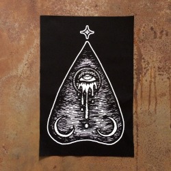 poisonappleprintshop:  The Oracle Planchette // POISON APPLE PRINTSHOP A combination of magical elements come together here to create a haunting image of supernatural spirits and death. Two crescent moons rest at the bottom of an Ouija planchette, a