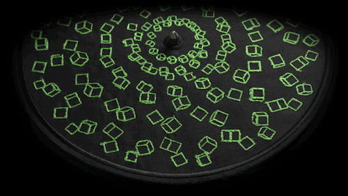 crossconnectmag:    	 		 						 							 					The Embroidered Animations of  Elliot Schultz Embroidered Zoetrope is a series of embroidered  animations, handcrafted on discs of fabric, that come to life thanks  to old turntables and synchronized strobe