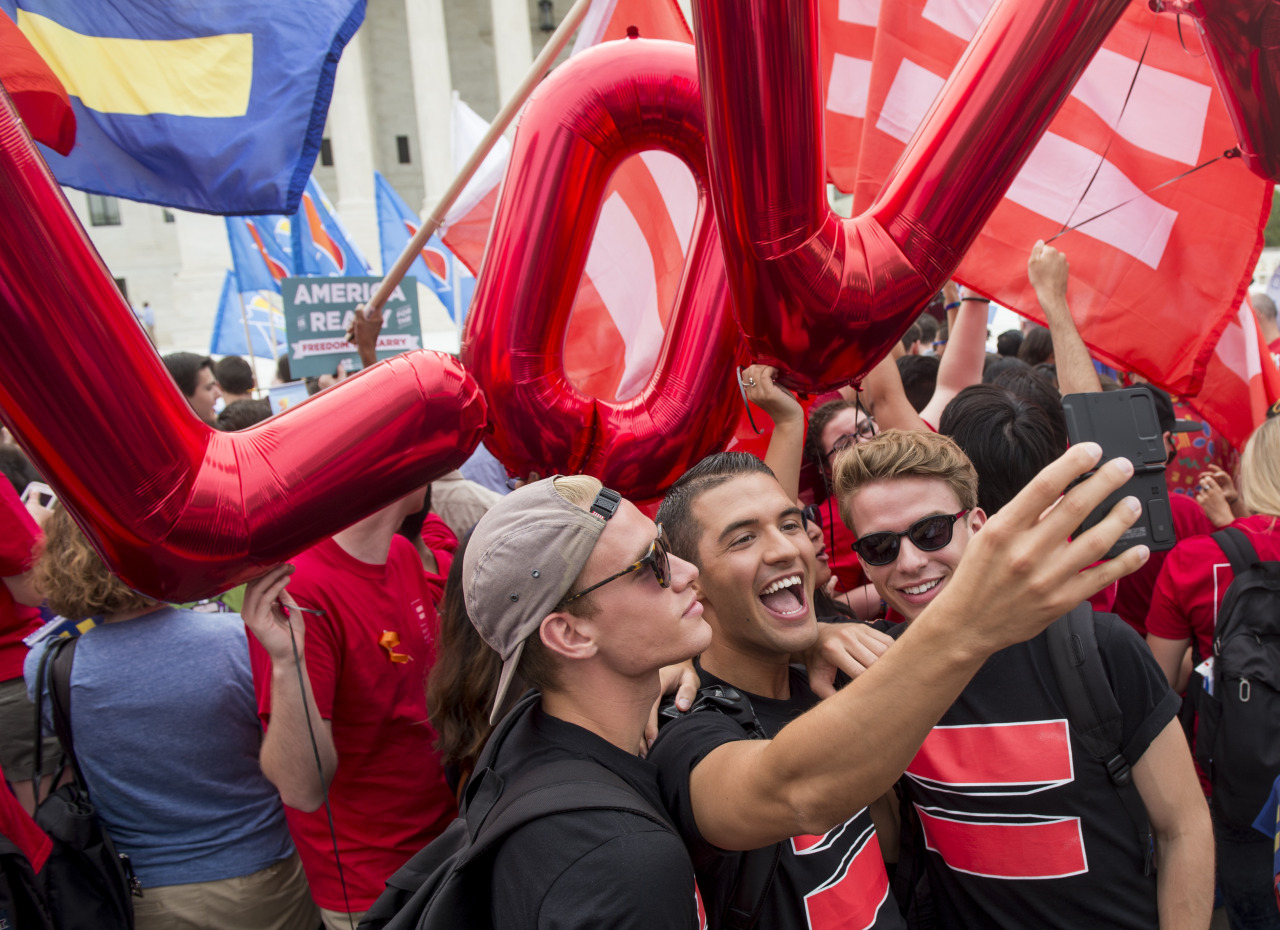 newsweek:    Washington DC - Same-sex marriage supporters take a selfie in front