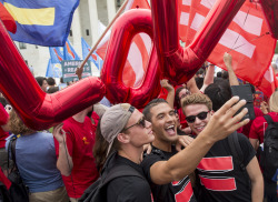 newsweek:    Washington DC - Same-sex marriage supporters take a selfie in front of the Supreme Court as they wait for the court to legalize same-sex marriages nationwide on Friday, June 26, 2015. In a 5-4 decision, the US Supreme Court legalized gay