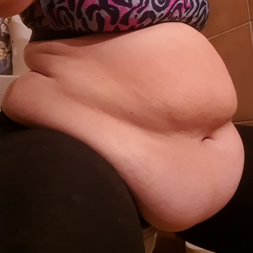 hotsummerfatty-reloaded:Not only my belly gets massive, my thighs grow also to carry the extra weight which I put on by my favorite fattening food, a heavy creamy vanilla shake
