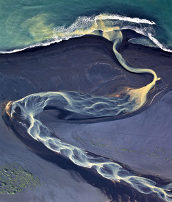 terra-mater:  Aerial Photographs of Volcanic Iceland   At first glance these photos by Andre Ermolaev look like twisting abstract paintings, but in reality are aerial photos of rivers flowing through Iceland’s endless beds of volcanic ash. Given its