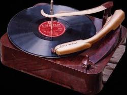 1948, Columbia Records introduces the 33 ⅓ -RPM long player. The old shellac 78 rpm, limited the playing time of a 12-inch record to less than five minutes per side. The new product was a 12 or 10-inch fine-grooved disc made of vinyl and played with