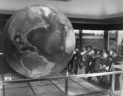amnhnyc:  Happy Earth Day! From the archives: Children viewing Globe of the World exhibit in the Hall of Earth History. Photographed by Alex J. Rota in 1969.  AMNH/333906 Find more many more archival images on our new online database of digital images
