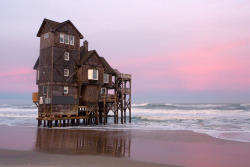 destroyed-and-abandoned:  The Last Inn on the Sea. Rodanthe, NC. . Source: seagirtlight (flickr) ethan_kahn:  When the house was first built in the 1980s, there was over 400 feet of sand separating it from the Atlantic, with piles set in concrete 14 feet
