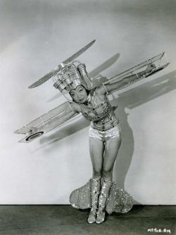 A chorus girl wearing a very unique dance costume!..
