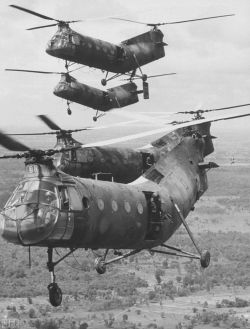 CH-21C Shawnees over Vietnam US crews &amp; gunners, transport ARVN troops to battle areas near Cambodian border.Removed vertical stabilizers suggests 8th Trans units Photo by Larry Burrows for LIFE, 1964