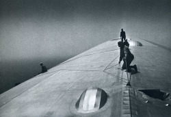 Graf Zeppelin Maintenance crewmen repairing damage caused by storm over the South Atlantic Ocean en route to Rio De Janeiro.photo by Alfred Eisenstaedt, 1934